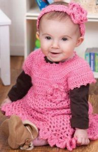 Bright pink crochet baby dress