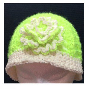 Bright green beanie with flower