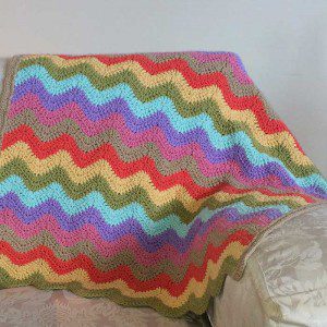 Pastel colour blanket on couch