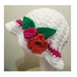 White crochet hat pink stripe and red flowers